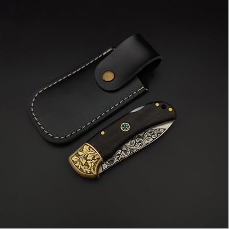 El yapımı N690 çelik üzerine gravür işlemeli kamp çakısı